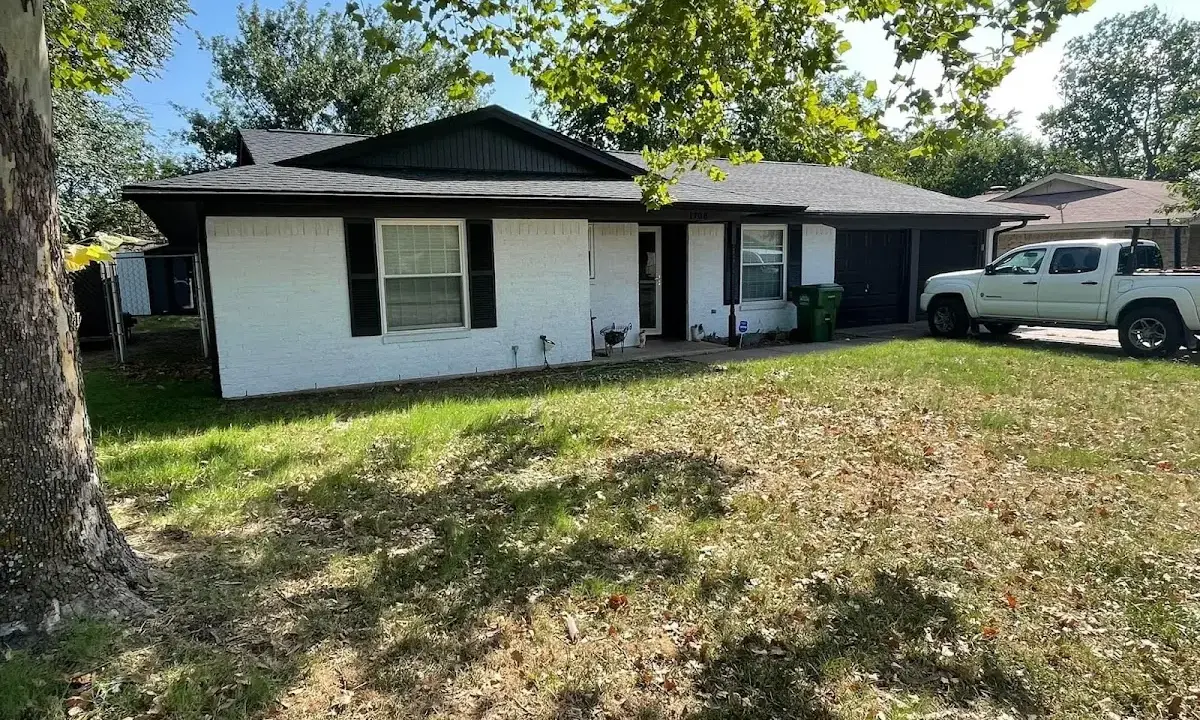 Professional roofing crew working on a residential roof in Wolfeboro